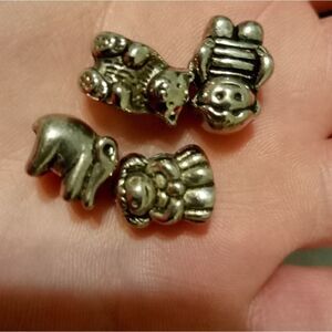 Four silver charms to fit Pandora and other European style bracelets